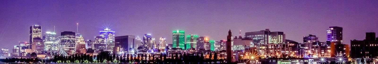 Montreal skyline at night with Ferris wheel and illuminated towers